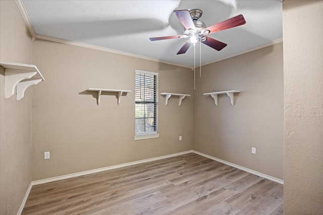 unfurnished room featuring light hardwood / wood-style floors, ceiling fan, and crown molding