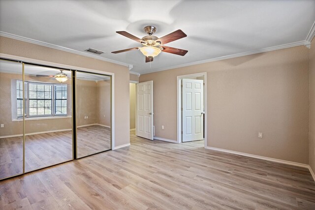 unfurnished bedroom featuring a closet, ceiling fan, ornamental molding, and light hardwood / wood-style floors