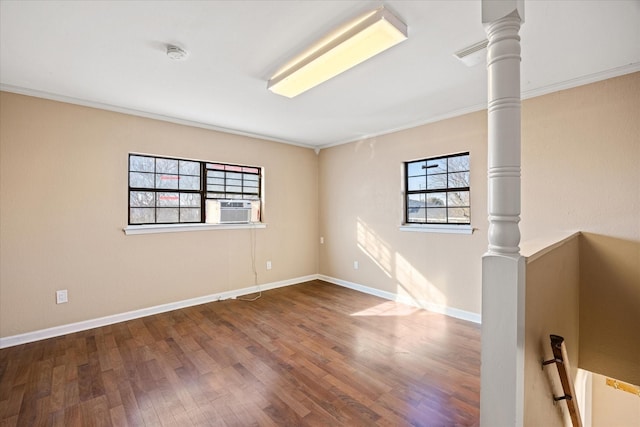 unfurnished room featuring wood-type flooring, cooling unit, and ornamental molding