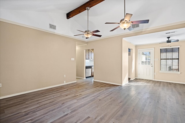 unfurnished living room with ornamental molding, wood-type flooring, and vaulted ceiling with beams