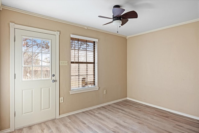 doorway featuring ceiling fan, light hardwood / wood-style floors, and crown molding