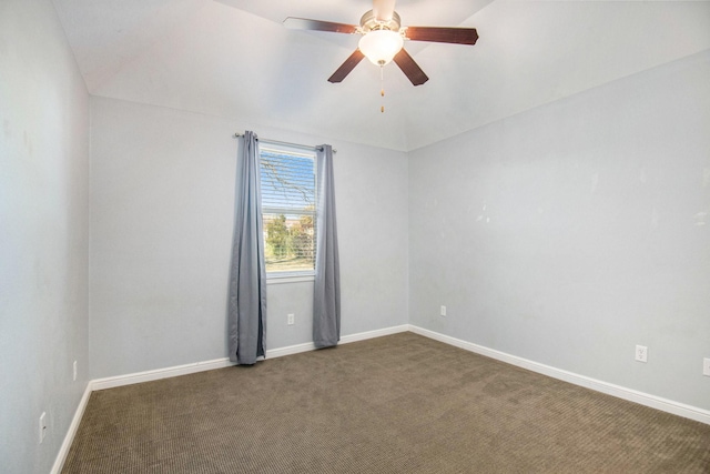 unfurnished room with dark carpet and ceiling fan