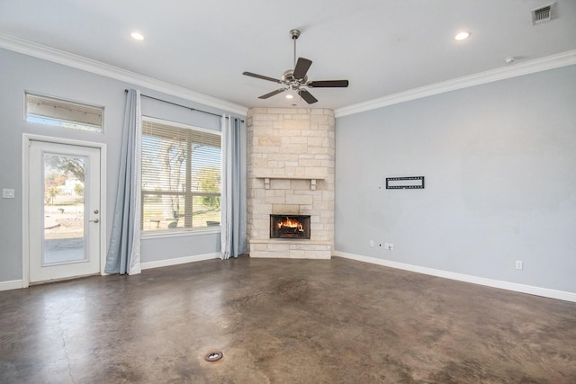 unfurnished living room with a stone fireplace, ceiling fan, and ornamental molding