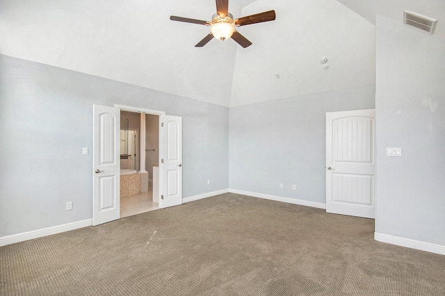 spare room with carpet flooring, ceiling fan, and vaulted ceiling