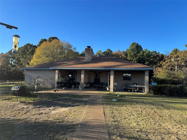 view of front of property with a front lawn and a patio