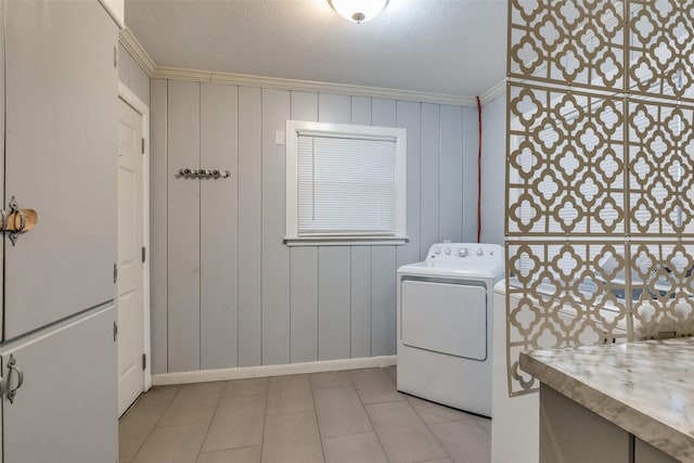 clothes washing area featuring washer / dryer and crown molding