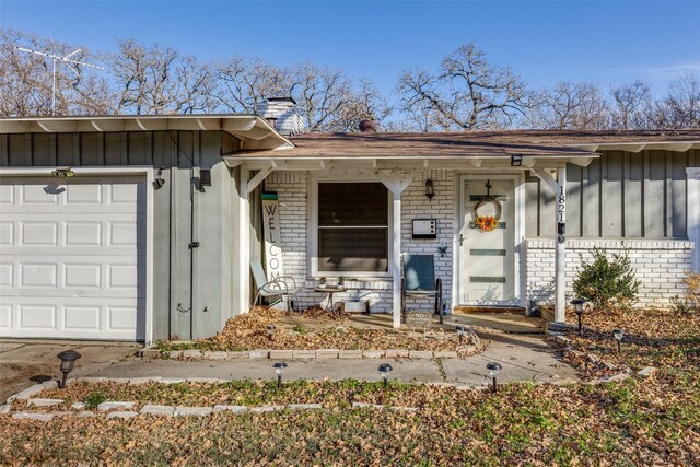 property entrance with a garage