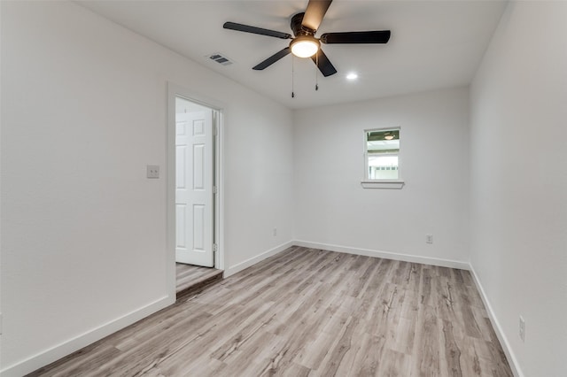 unfurnished room with ceiling fan and light wood-type flooring