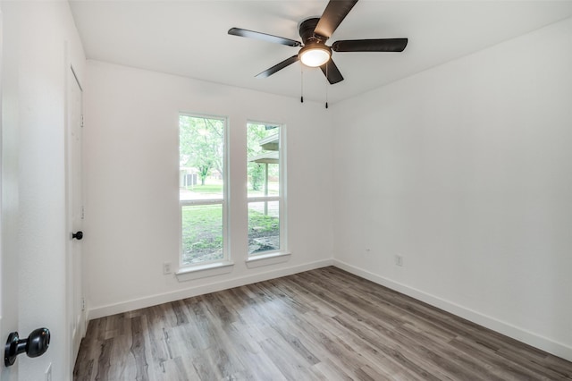 spare room featuring ceiling fan and light wood-type flooring