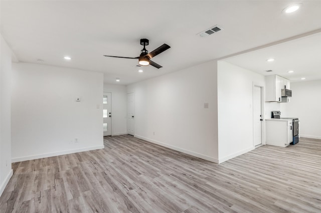 empty room featuring light hardwood / wood-style flooring and ceiling fan