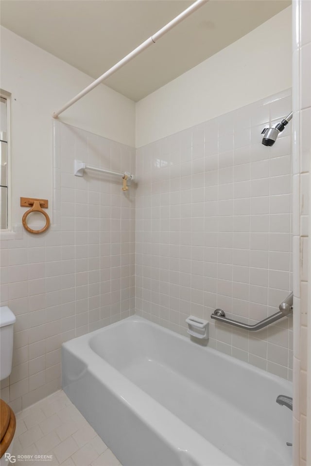 bathroom featuring tile patterned floors, shower / bathtub combination, and toilet