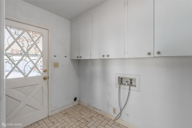 laundry room with cabinets, hookup for a washing machine, and plenty of natural light