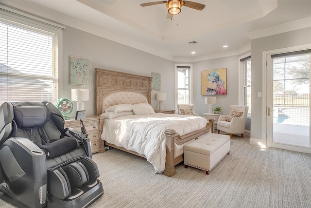 bedroom with a raised ceiling, access to exterior, ceiling fan, and ornamental molding