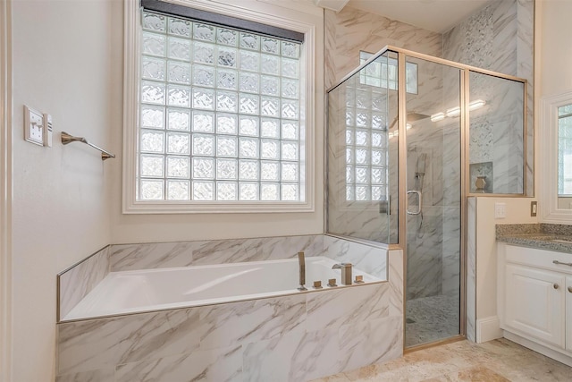 bathroom with vanity, plenty of natural light, and shower with separate bathtub