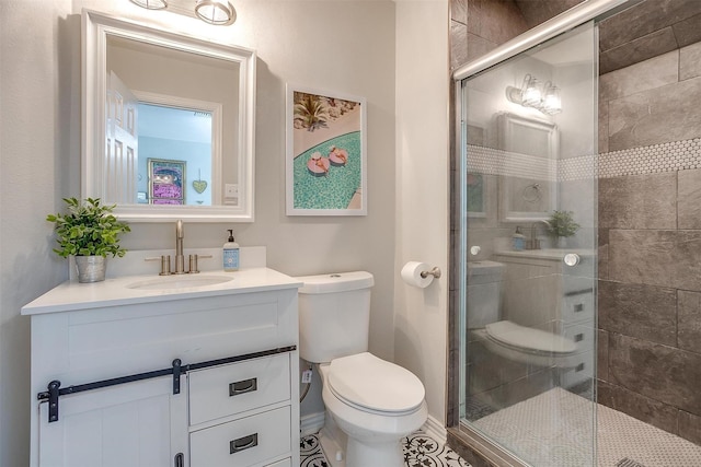 bathroom featuring toilet, tile patterned flooring, walk in shower, and vanity