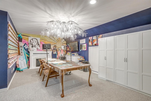 carpeted dining room featuring a chandelier