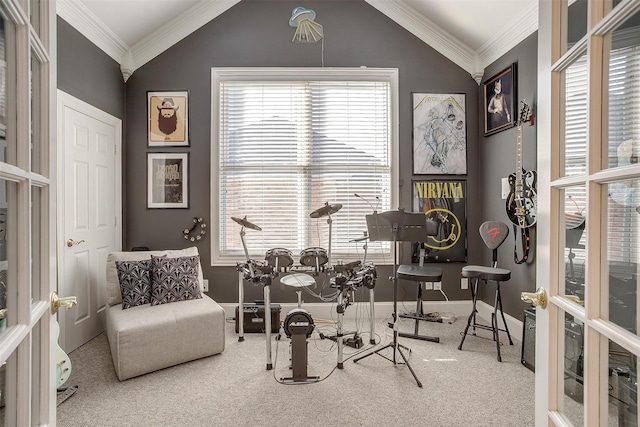 interior space with lofted ceiling, carpet flooring, and ornamental molding