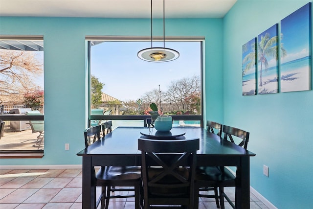 dining area with tile patterned flooring and a healthy amount of sunlight