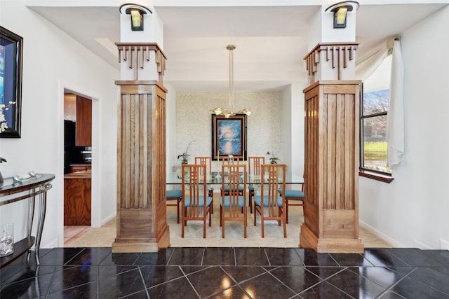 dining space featuring ornate columns