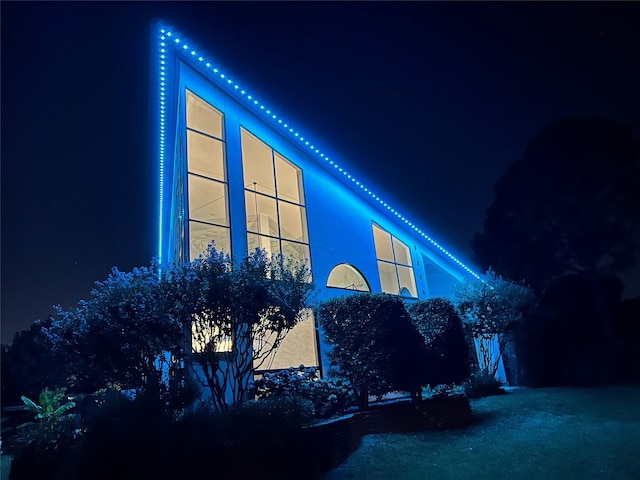 3611 Sunrise Bay Pt, Little Elm, TX 75068 - property exterior at night with stucco siding