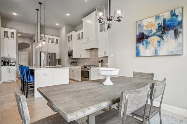 tiled dining area with sink