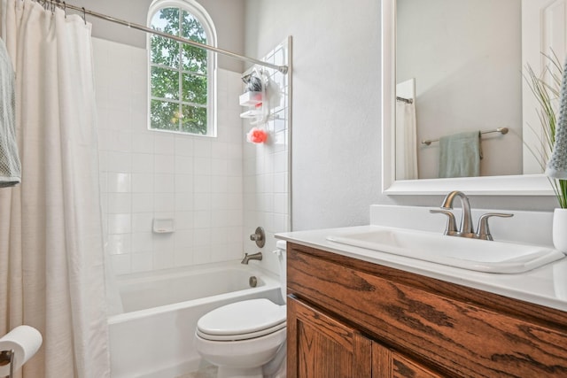 full bathroom featuring shower / bath combo with shower curtain, vanity, and toilet