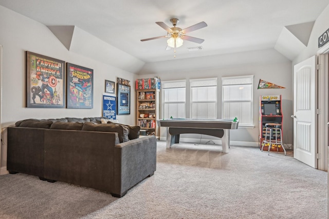 carpeted living room with ceiling fan and lofted ceiling