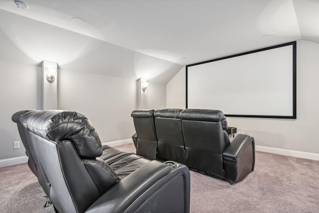 carpeted cinema featuring lofted ceiling