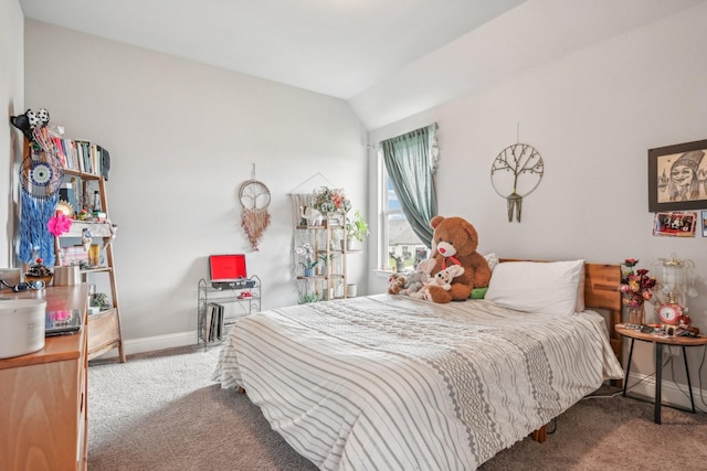 bedroom with carpet floors and vaulted ceiling