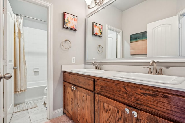 full bathroom featuring tile patterned floors, vanity, toilet, and shower / bath combo with shower curtain