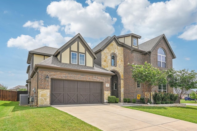 view of front of house featuring central AC unit, a garage, and a front lawn