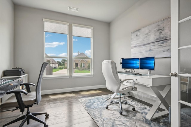 office area featuring a healthy amount of sunlight and wood-type flooring