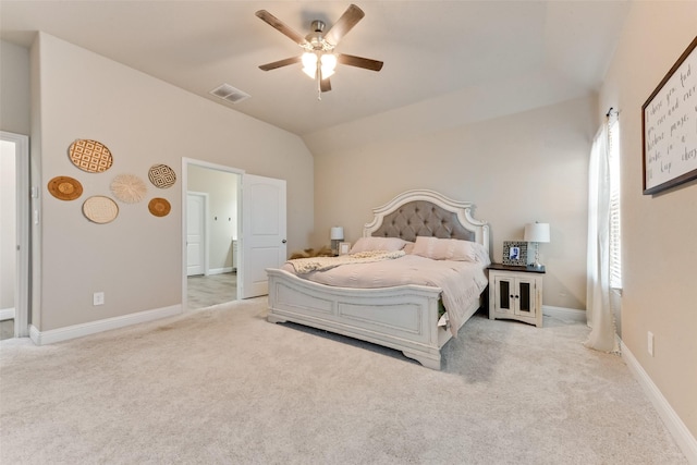 carpeted bedroom with ceiling fan and lofted ceiling