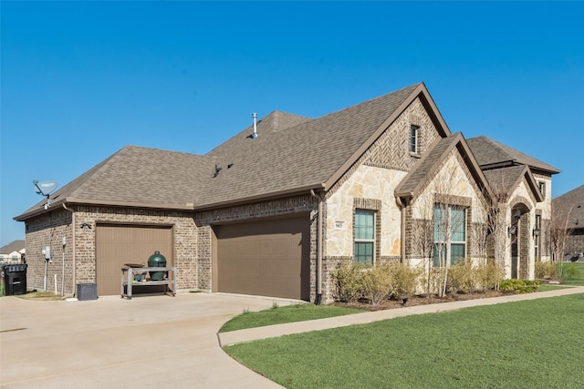 view of front of house with a front yard and a garage