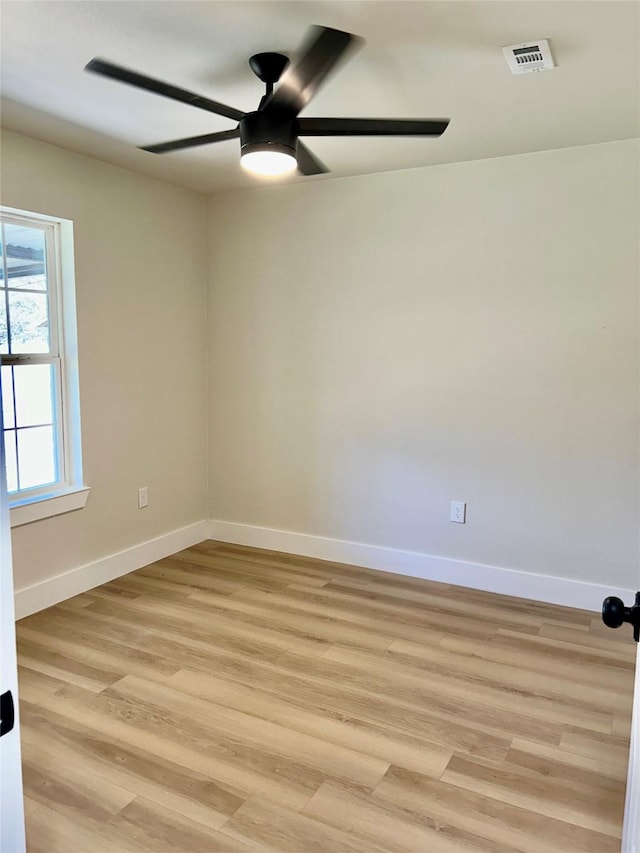 unfurnished room featuring ceiling fan and light wood-type flooring