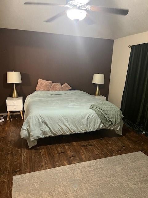 bedroom featuring dark hardwood / wood-style floors and ceiling fan