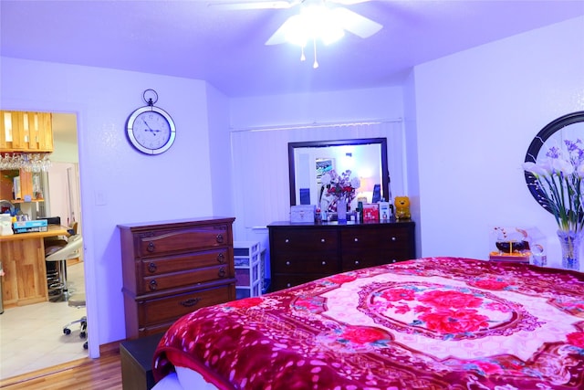 bedroom featuring ceiling fan and light hardwood / wood-style flooring