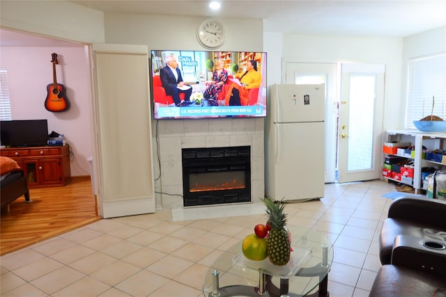 tiled living room with a fireplace