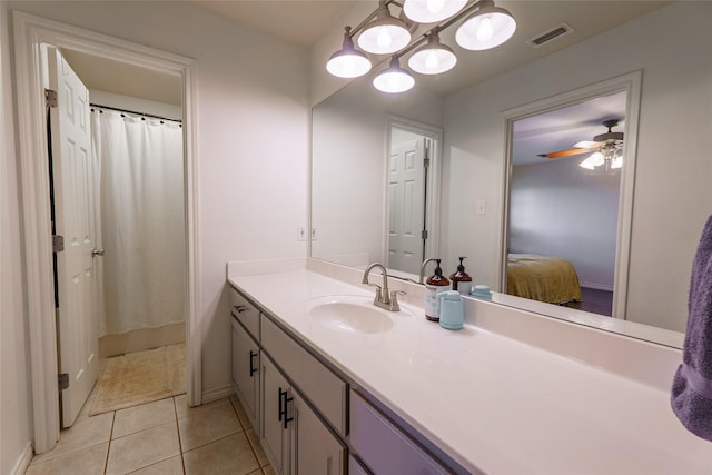 bathroom with tile patterned flooring, ceiling fan, curtained shower, and vanity