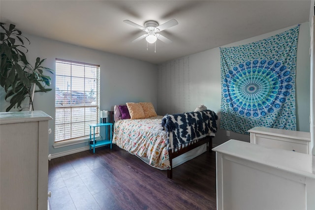 bedroom featuring ceiling fan and dark wood-type flooring