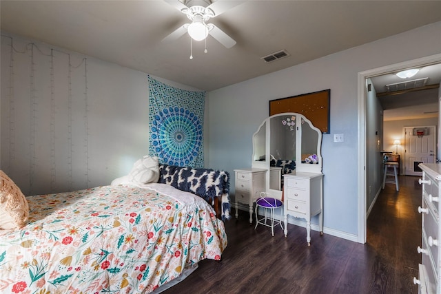 bedroom featuring dark hardwood / wood-style flooring and ceiling fan