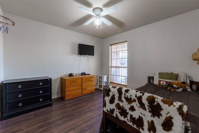 bedroom with ceiling fan and dark wood-type flooring