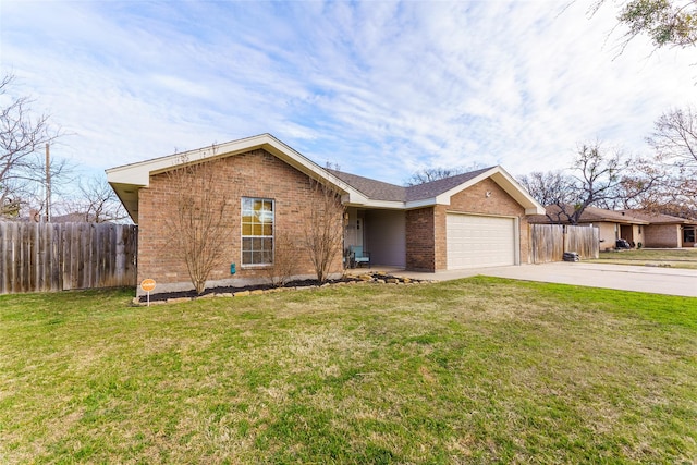 ranch-style house with a garage and a front yard