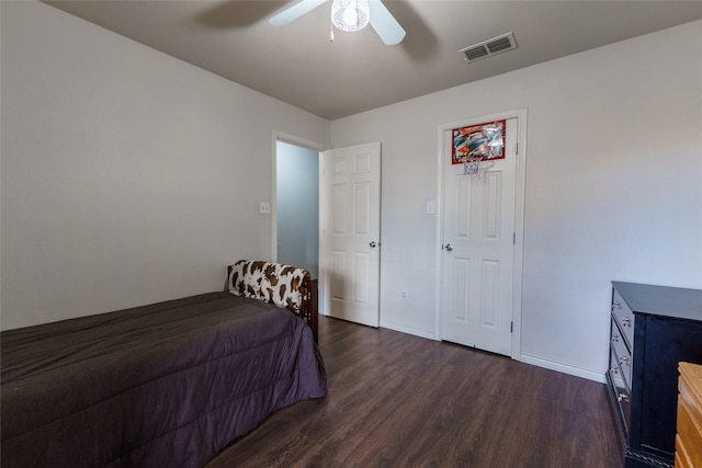 bedroom with ceiling fan and dark wood-type flooring