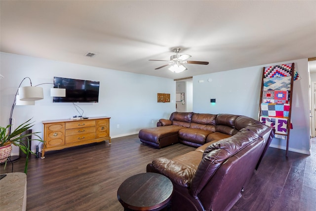 living room with ceiling fan and dark hardwood / wood-style floors