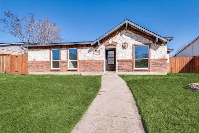 ranch-style home with a front yard