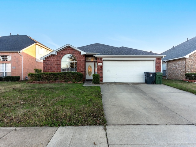 ranch-style home featuring a garage and a front lawn