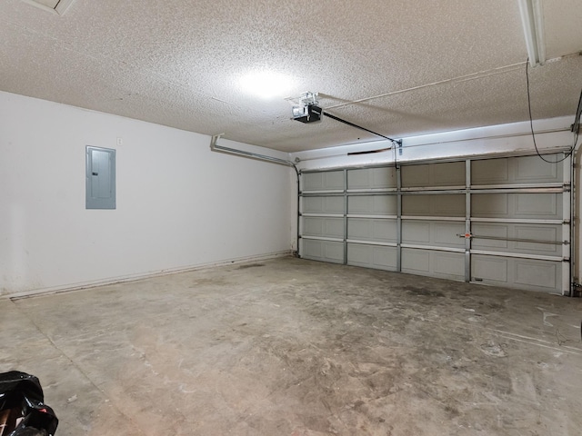 garage with a garage door opener and electric panel