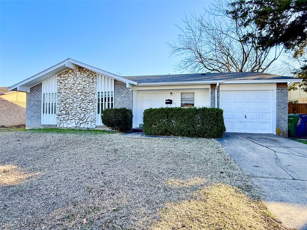 single story home featuring a garage