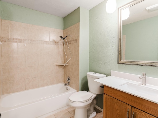 full bathroom featuring tile patterned floors, vanity, toilet, and tiled shower / bath combo